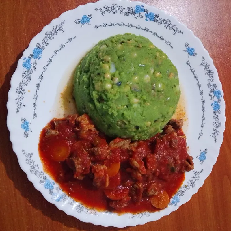 Mokimo cooked by non-native Karibu lunch mokimo served with beef stew.